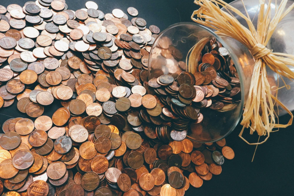 pennies falling from a jar