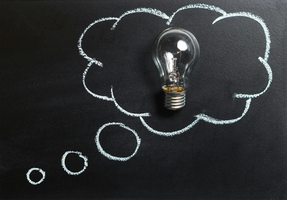 lightbulb against a chalkboard