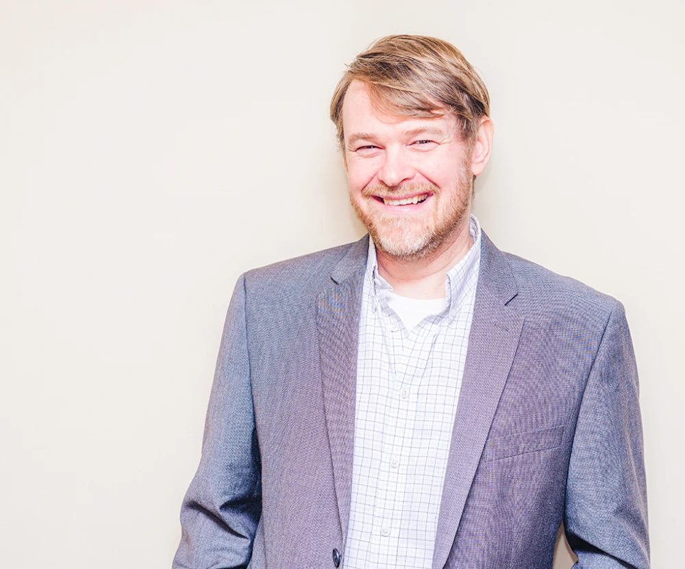 headshot of our founder